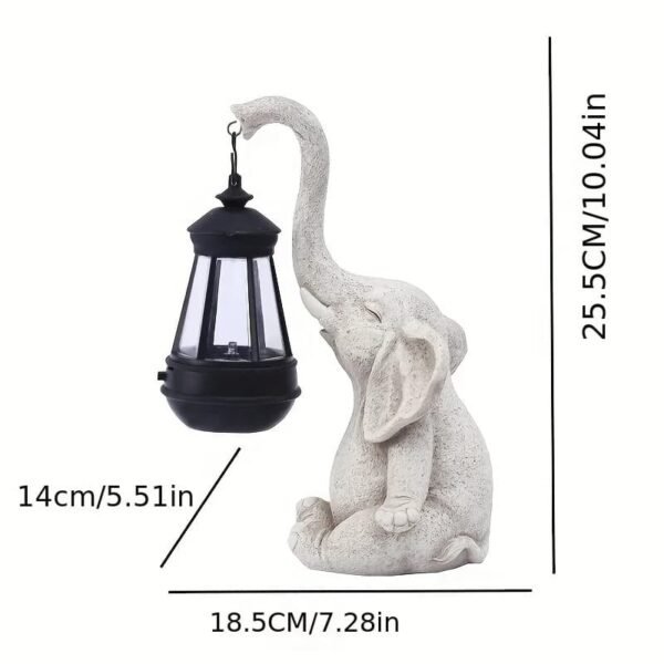 Statue d'éléphant avec lanterne solaire